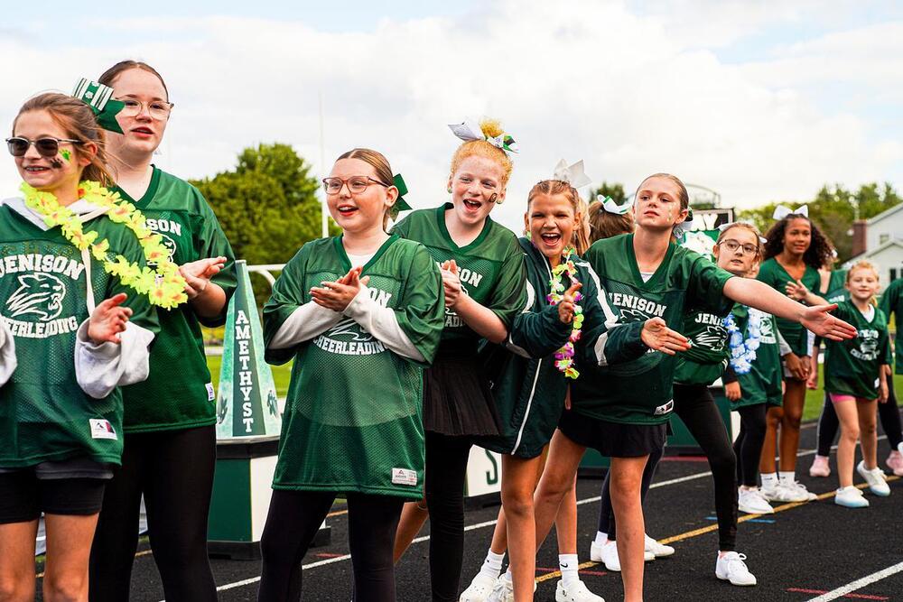 girls cheering in tunnel