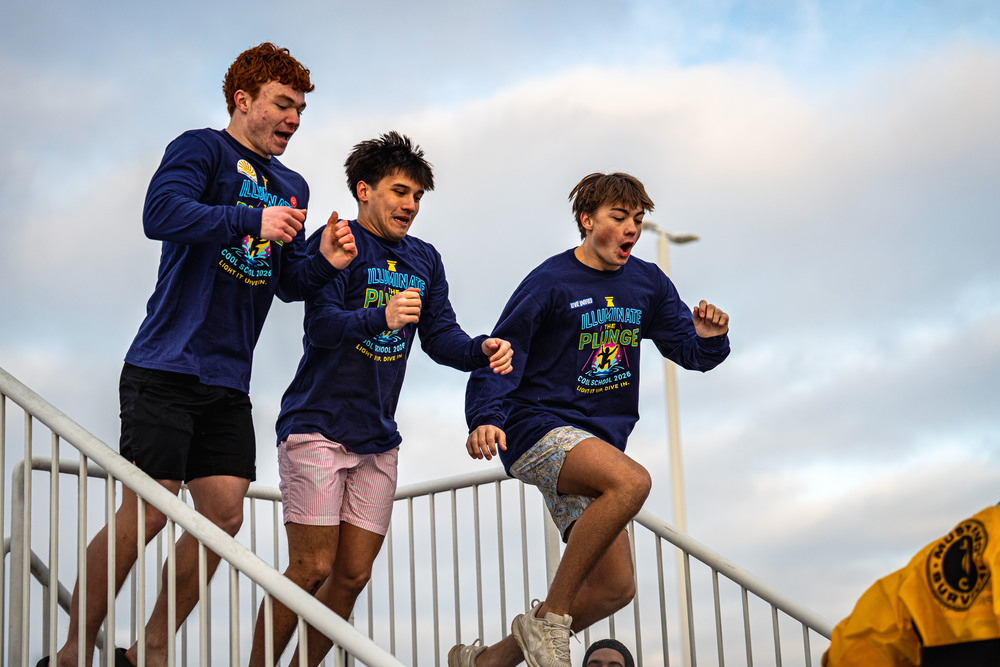 Students jumping in tub for polar plunge