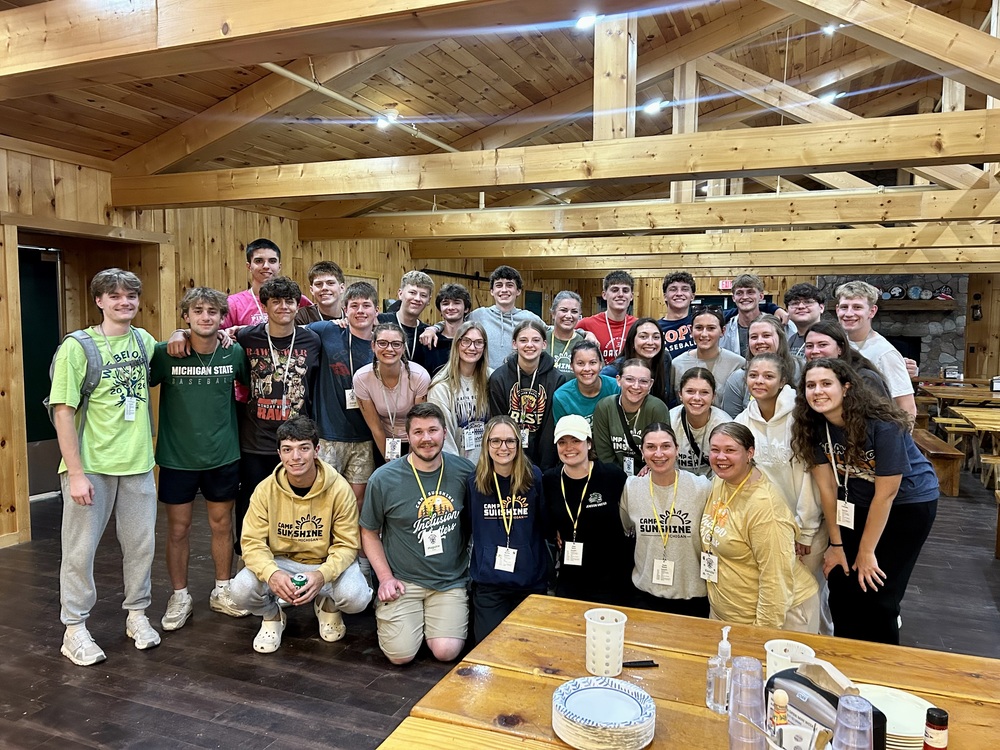 Jenison students and alumni posing at Camp Sunshine