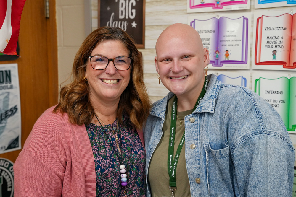 Teacher and student teacher posing together
