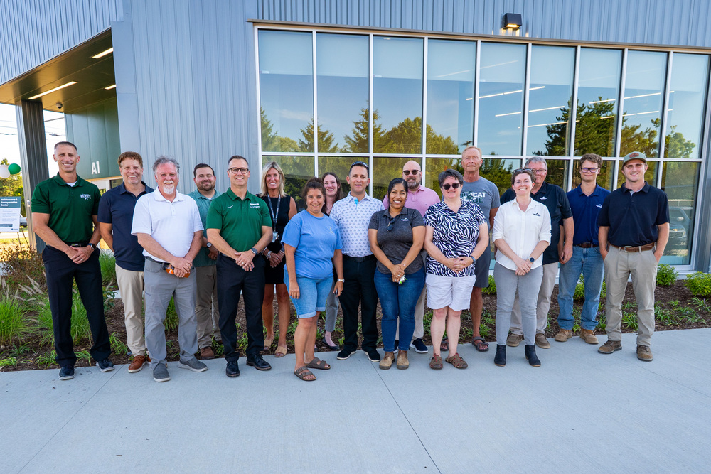 JPS staff and Triangle staff posing in front of new MTC