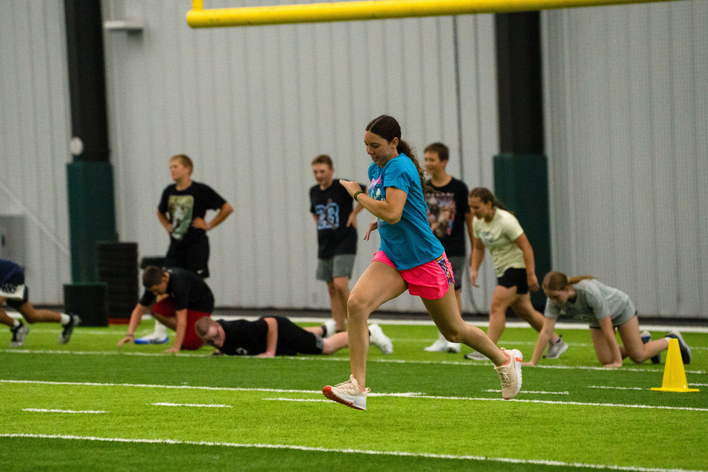 Students running on the field