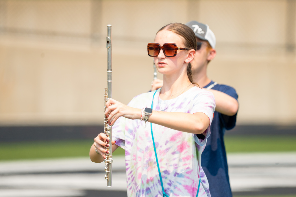 Marching band member plays