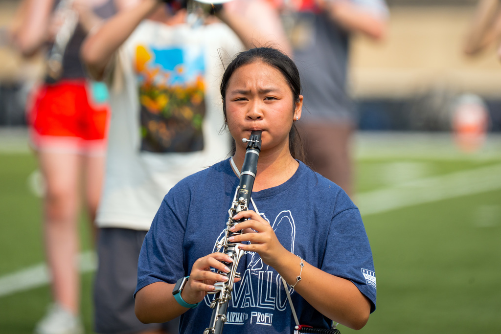 Marching band member plays