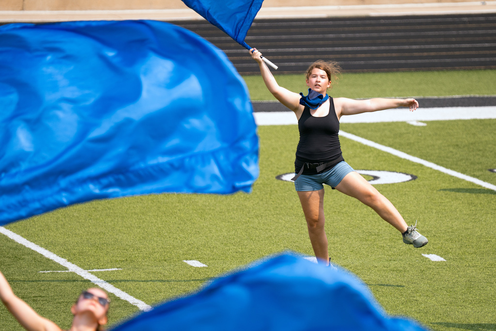 Marching band member plays