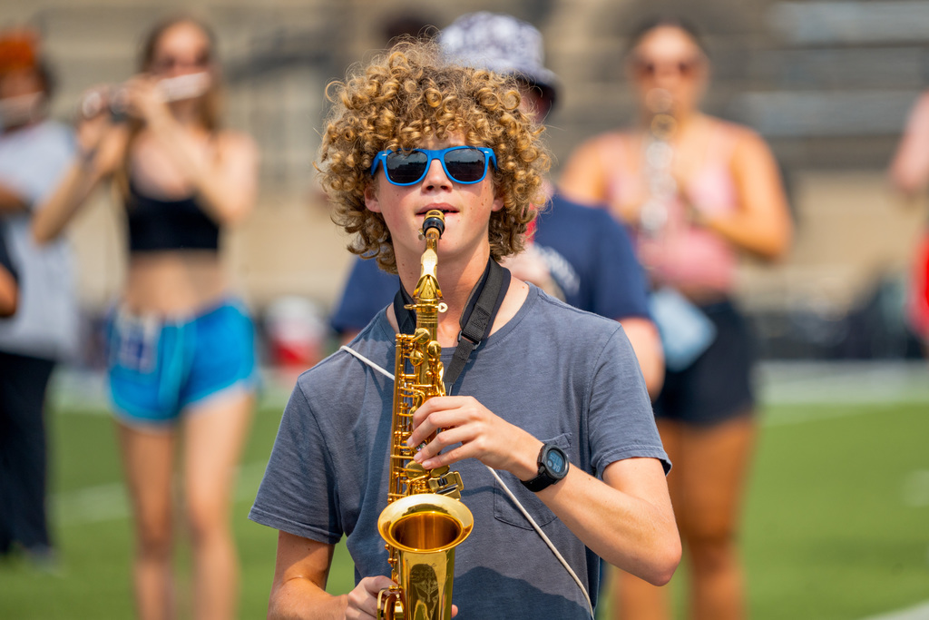 Marching band member plays