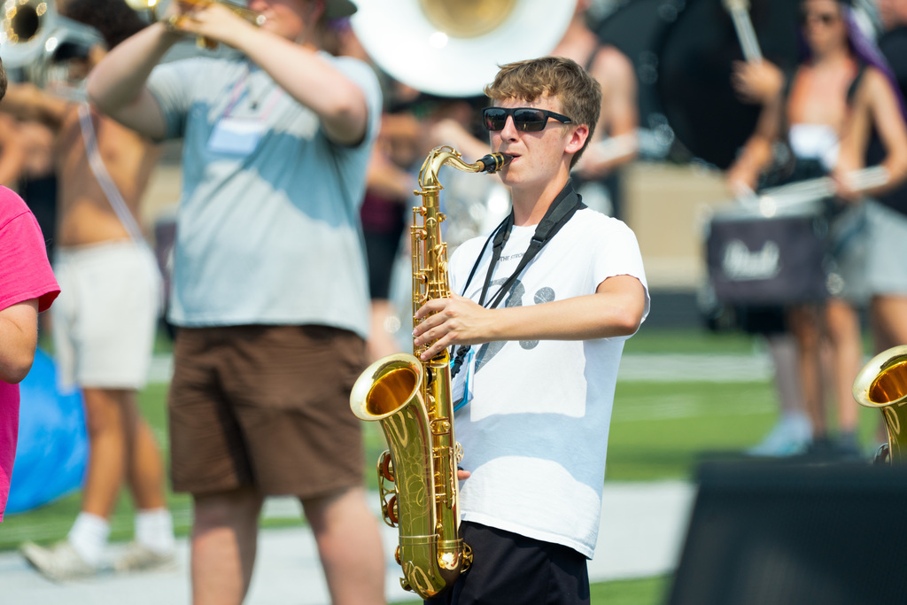 Marching band member plays