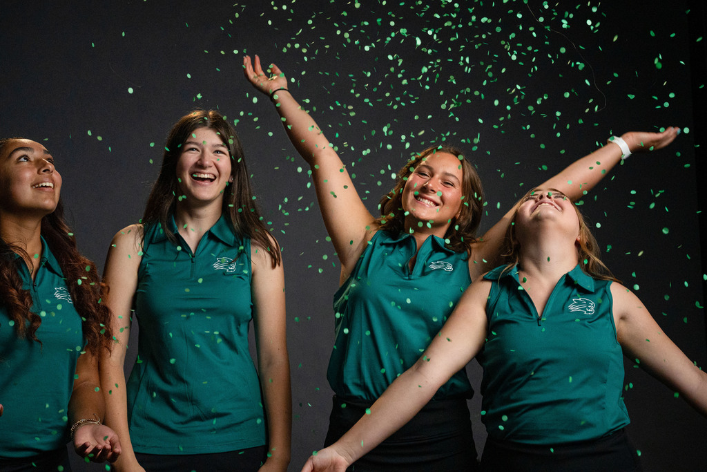 Girls golf players with confetti