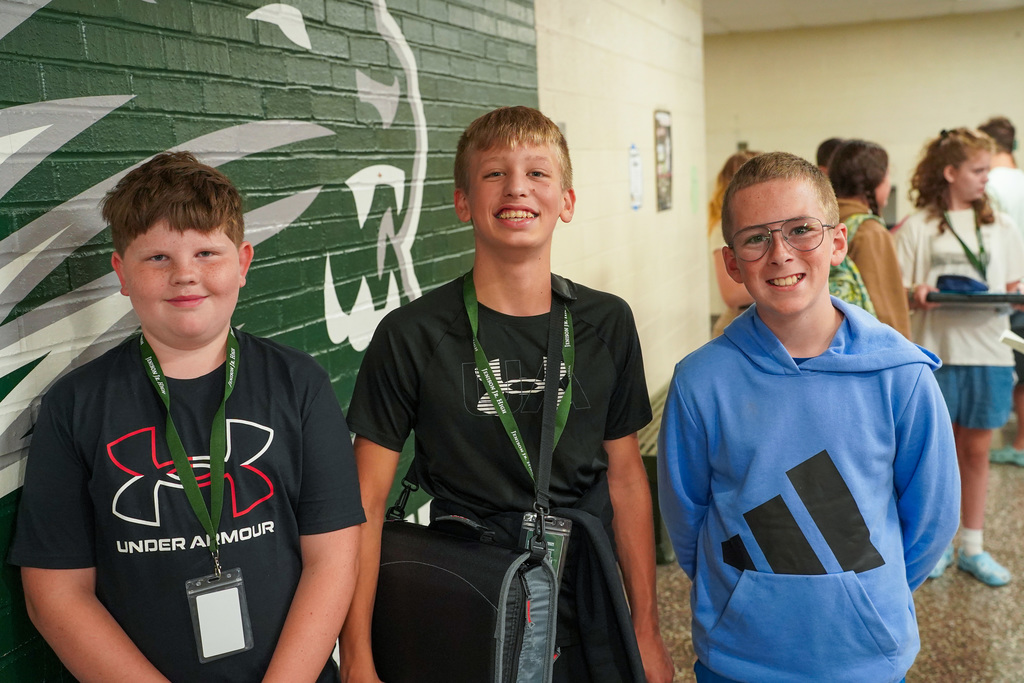 Students posing in hallway