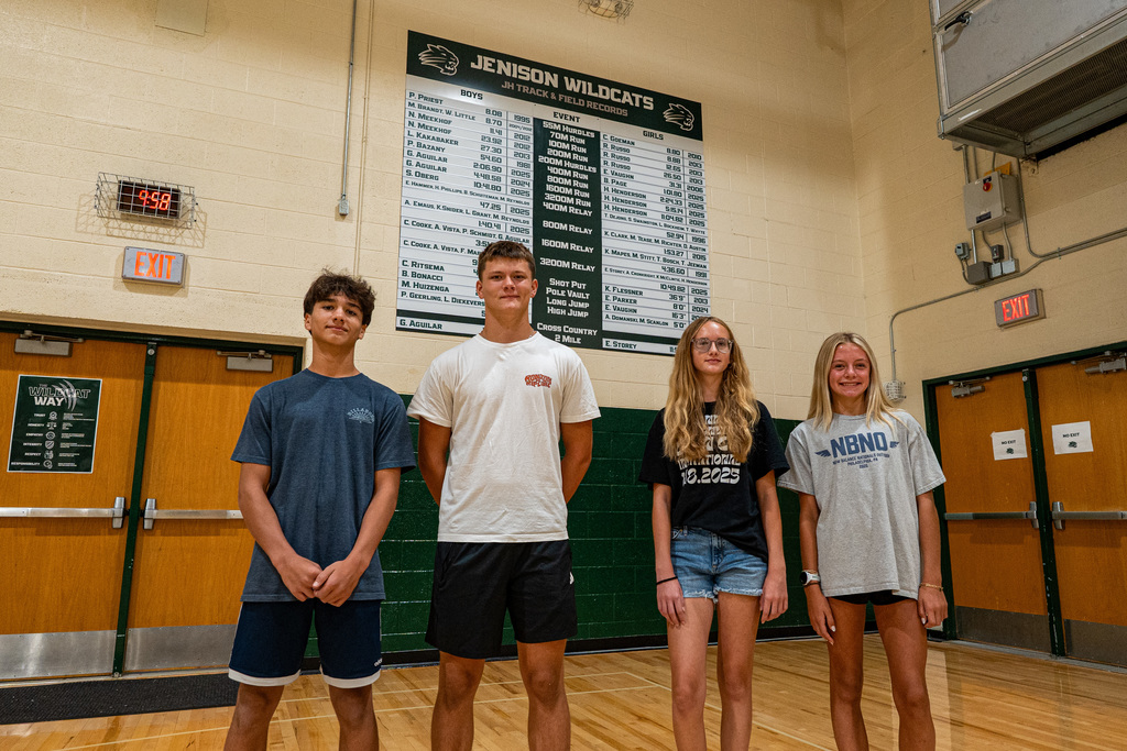 students posing in gym