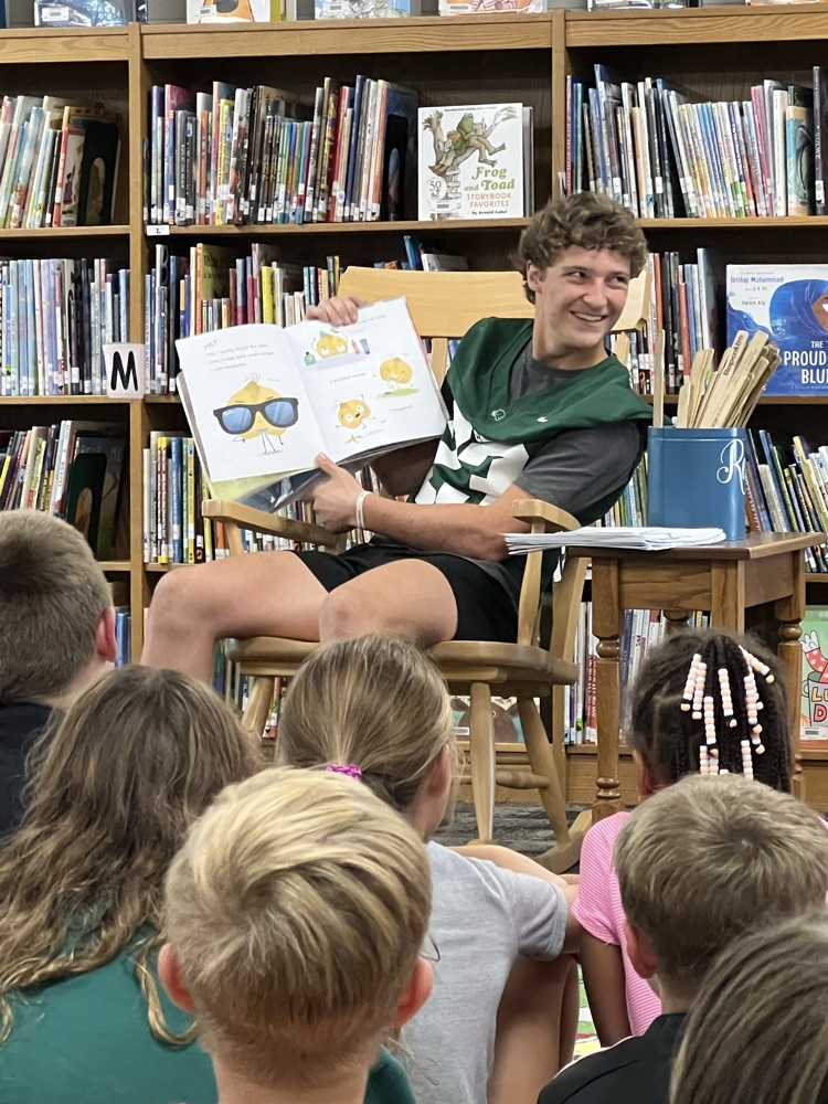 football player reading book