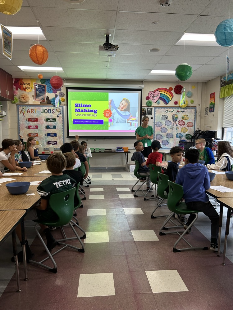 students at desks in class