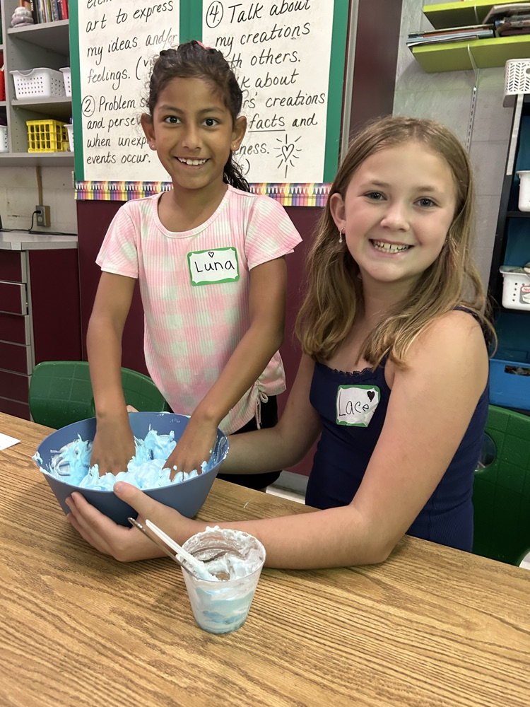 two girls mixing slime