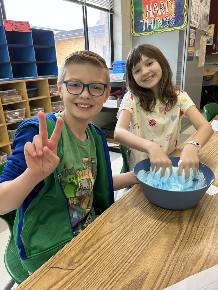 boy and girl mixing slime
