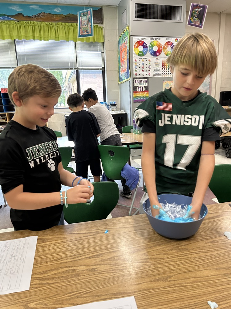 two boys mixing slime