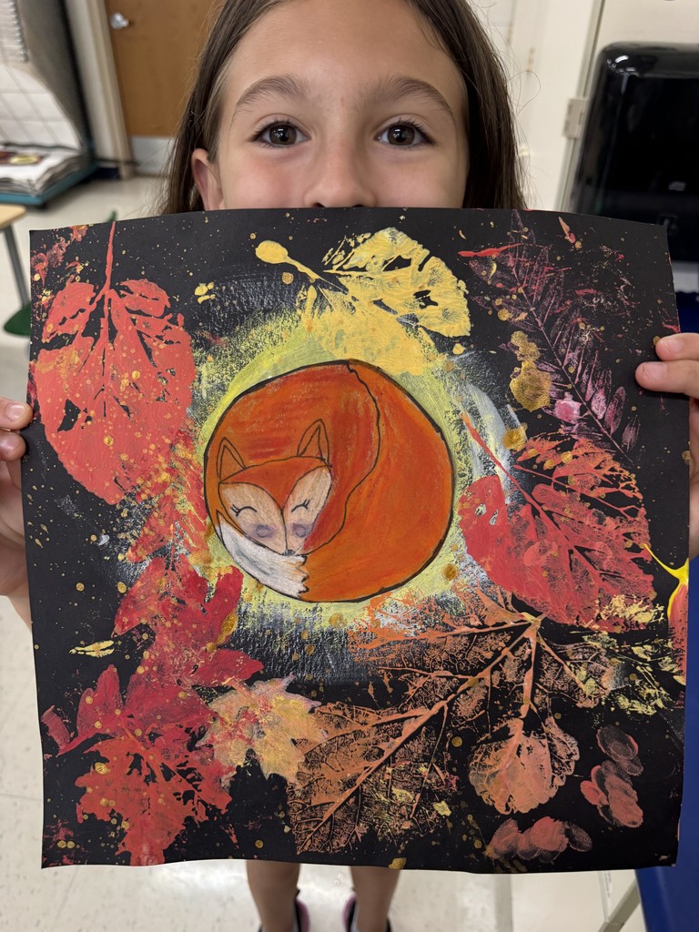 Student showing artwork