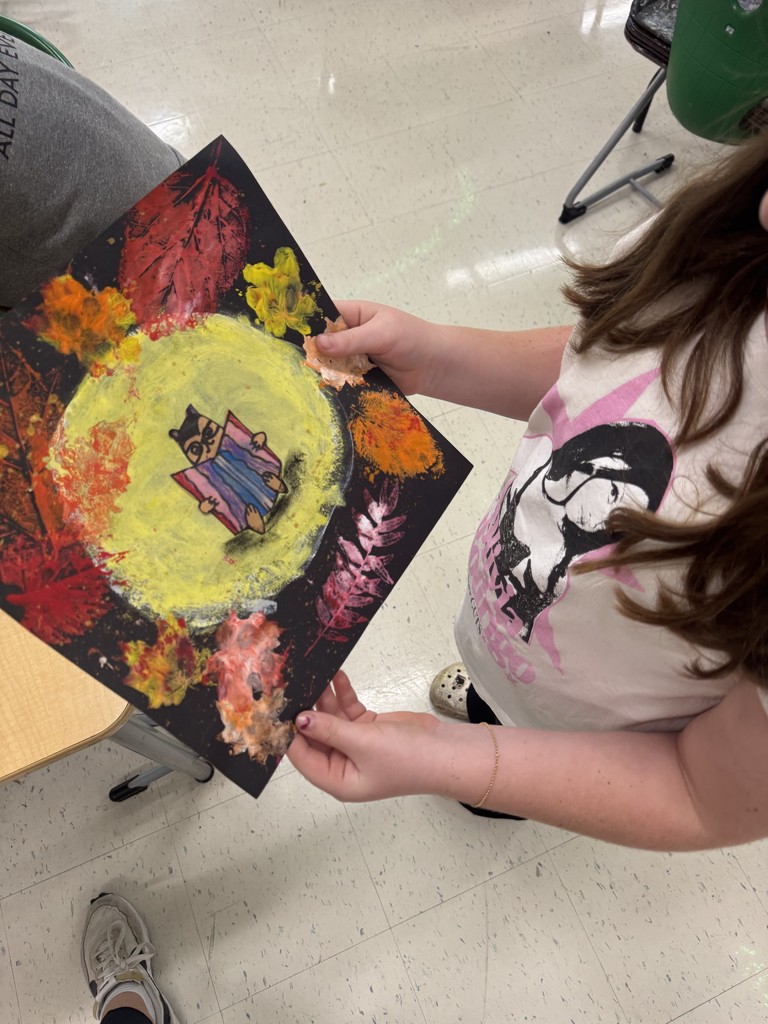 Student showing fall artwork