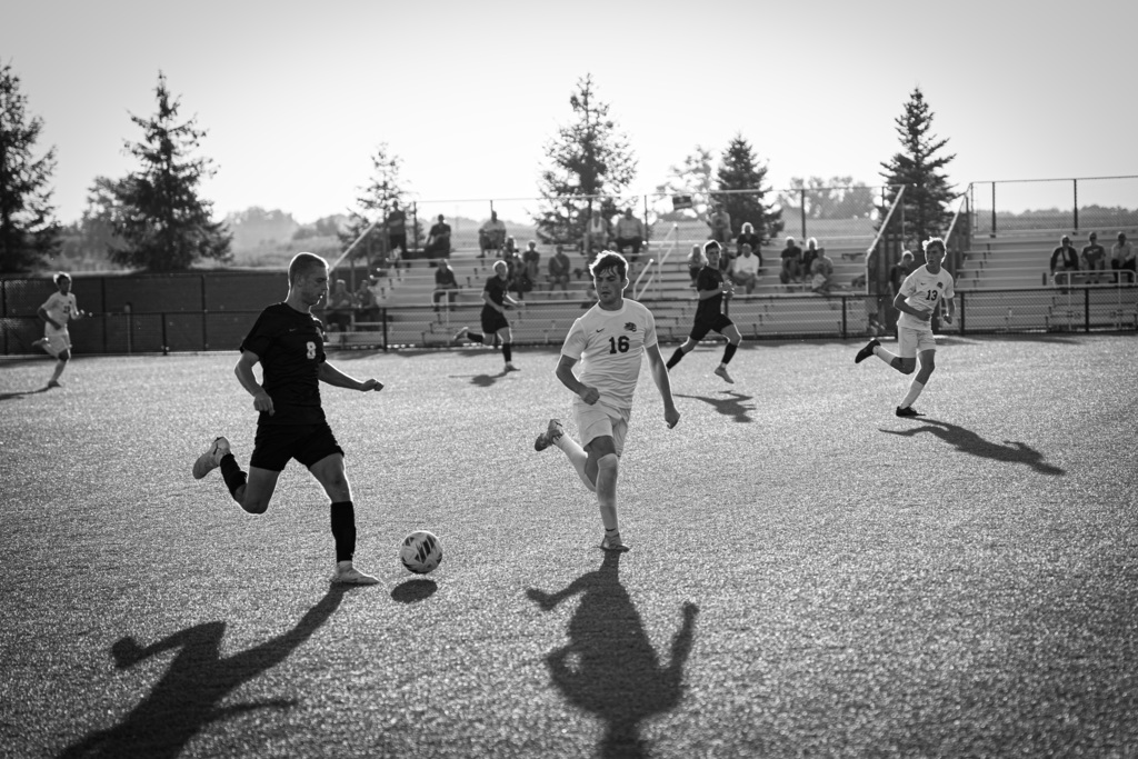 Boys soccer players running