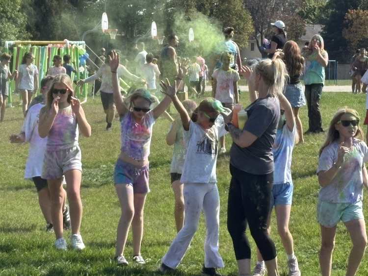 volunteer with powder at Color Run
