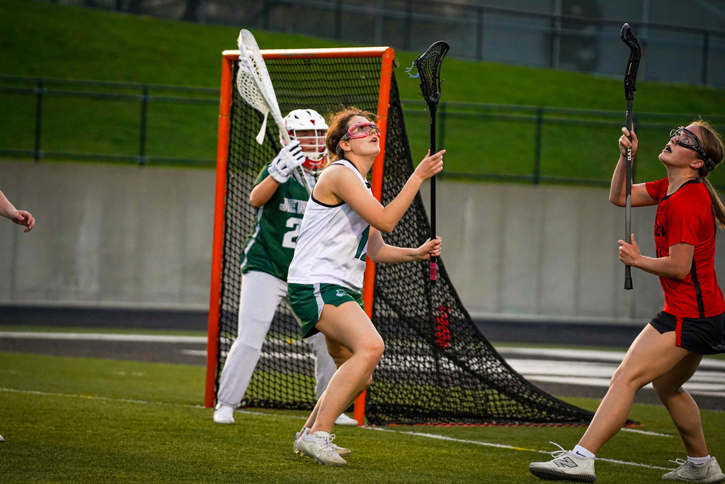 Girls lacrosse player on field