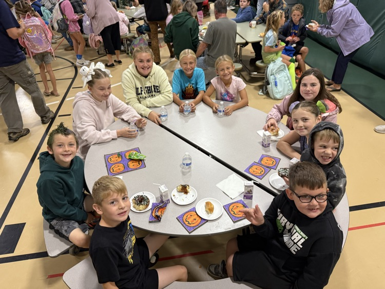 Group of students eating donuts