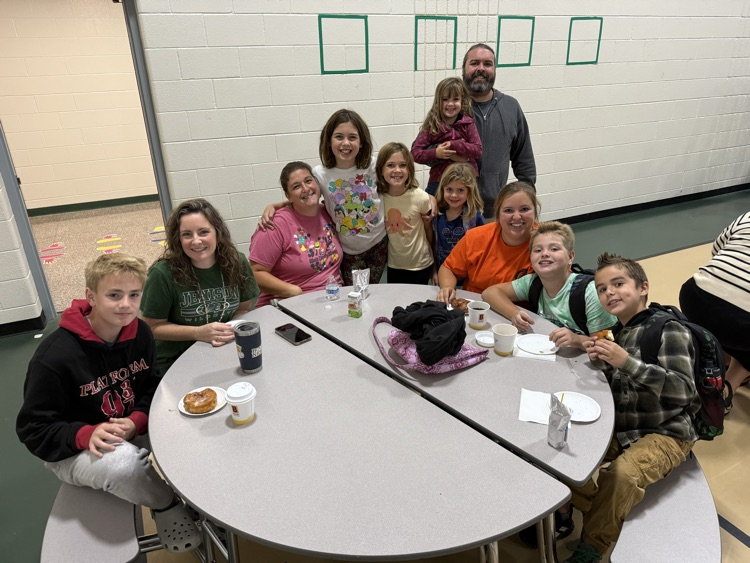 Group of people eating donuts