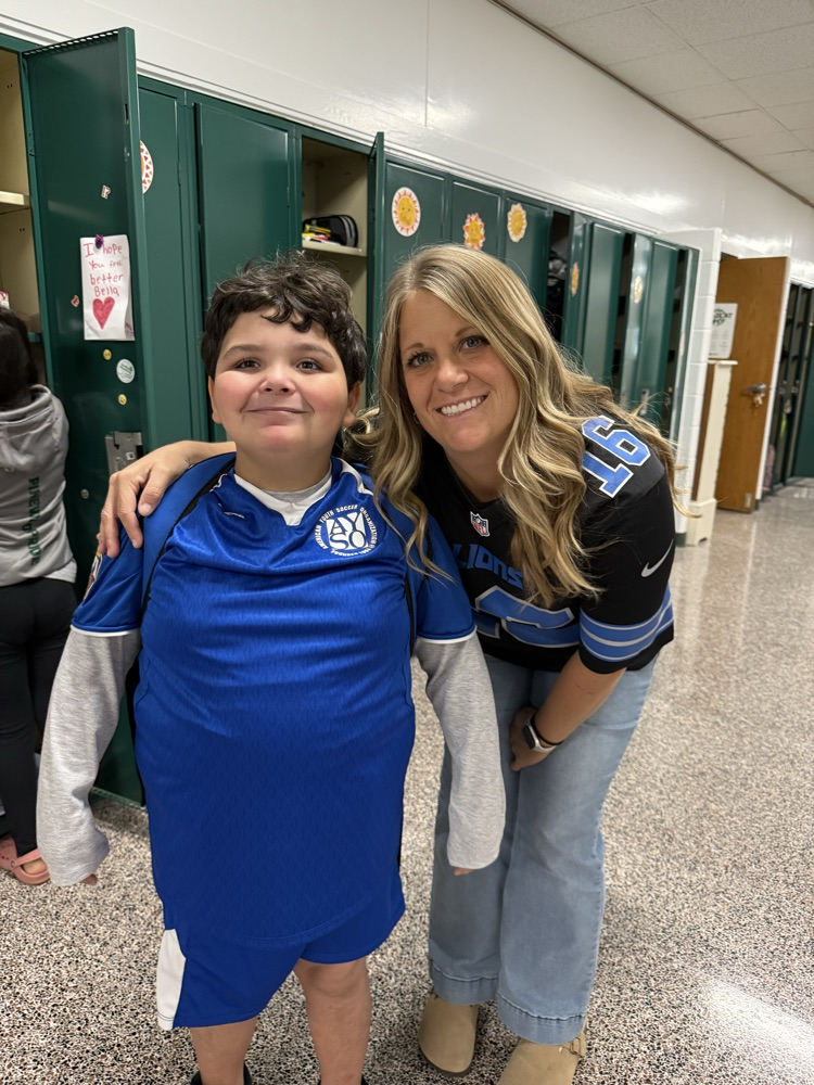 teacher and student wearing jerseys