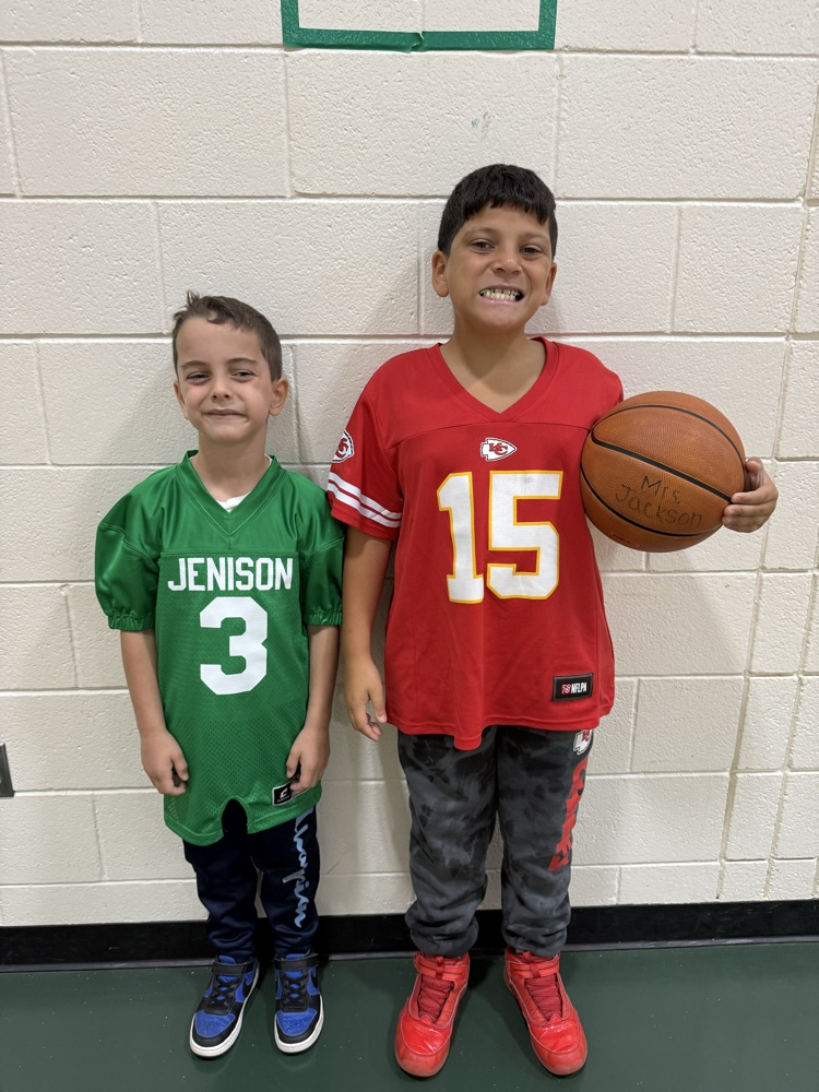 two students wearing jerseys