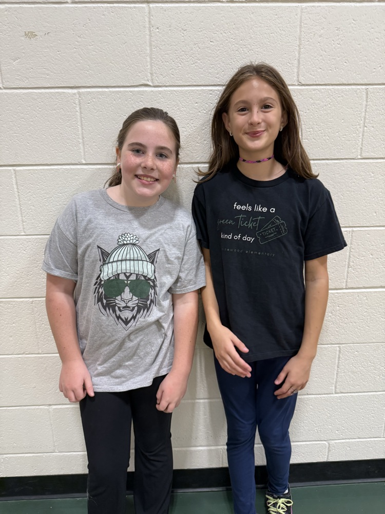 two girls wearing spirit wear