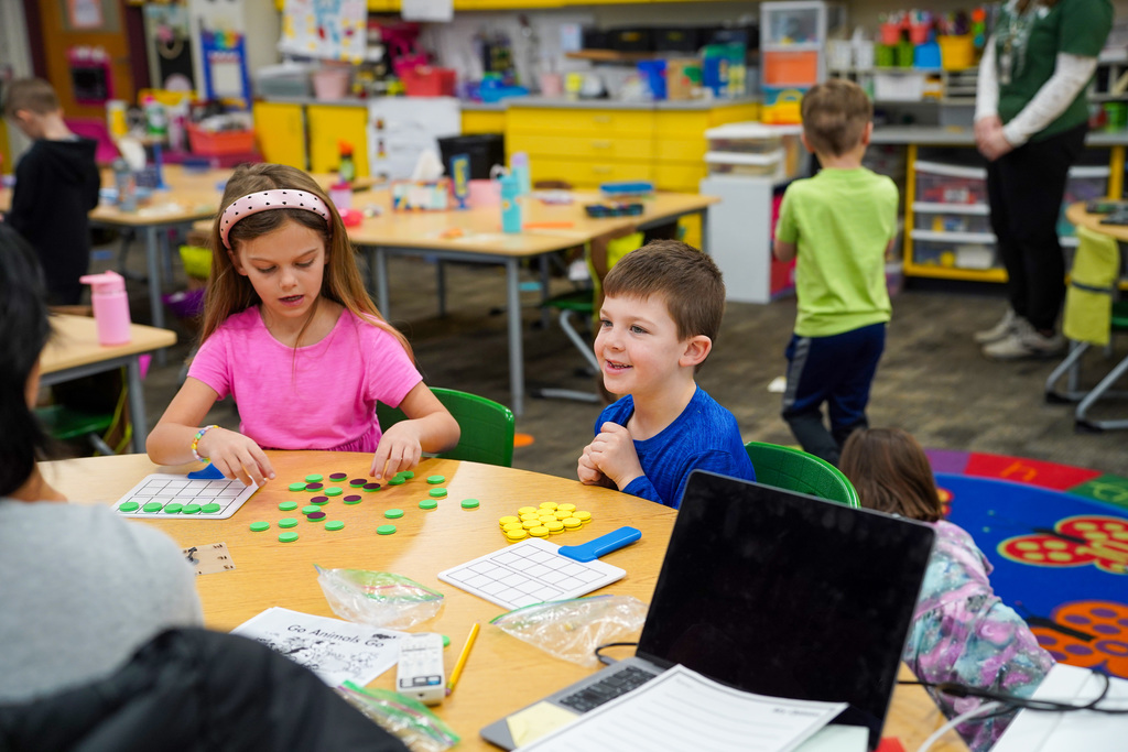 Kindergarten students sitting at table