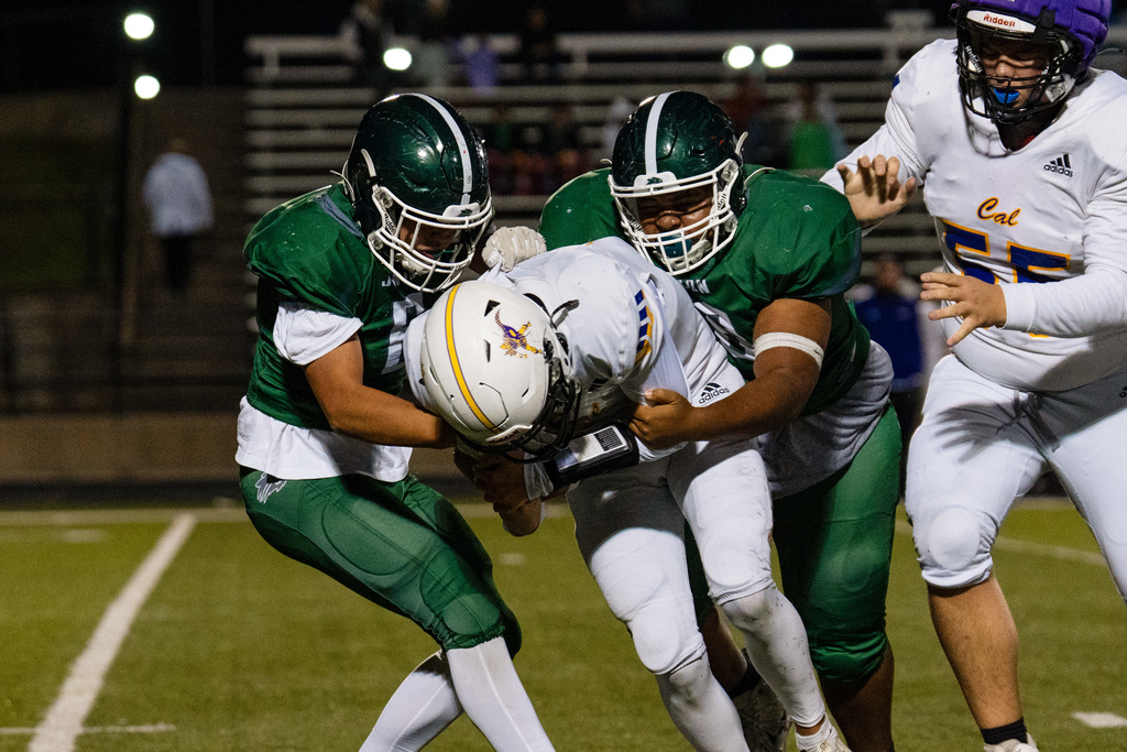 JV football players playing