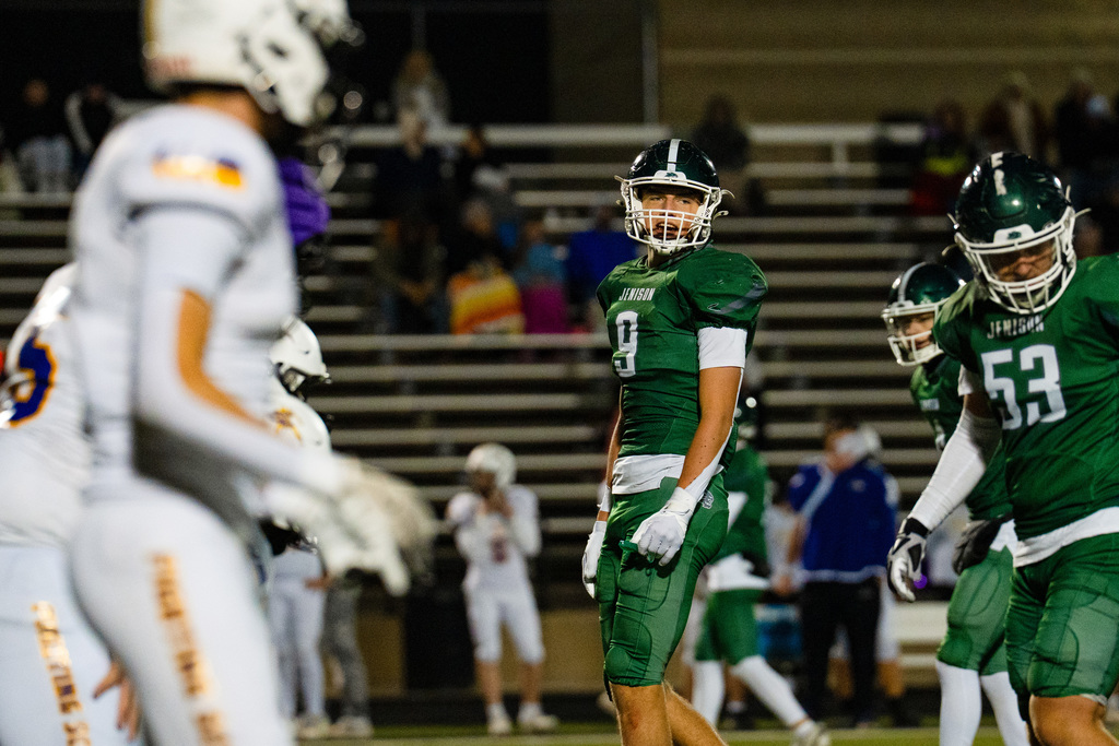 JV football players playing