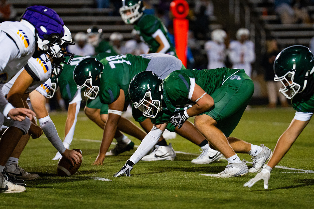 JV football players playing