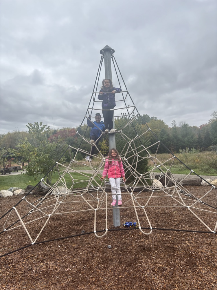 students on climbing structure