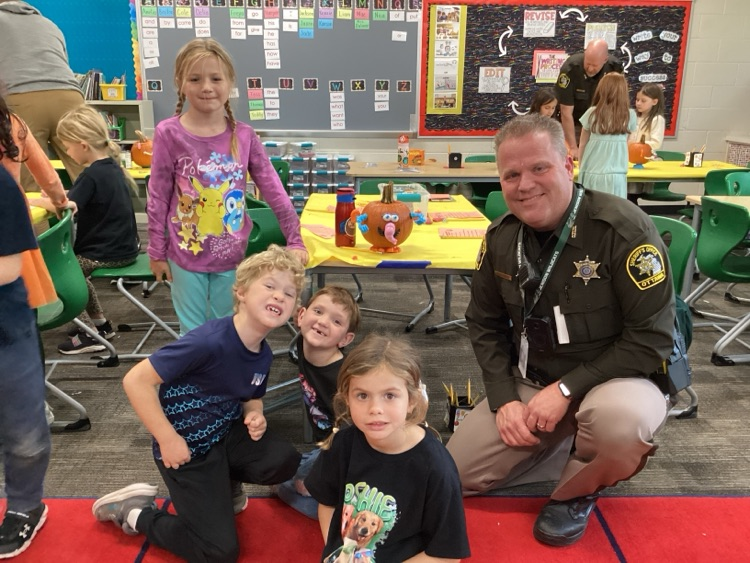 Students with SRO with decorated pumpkin
