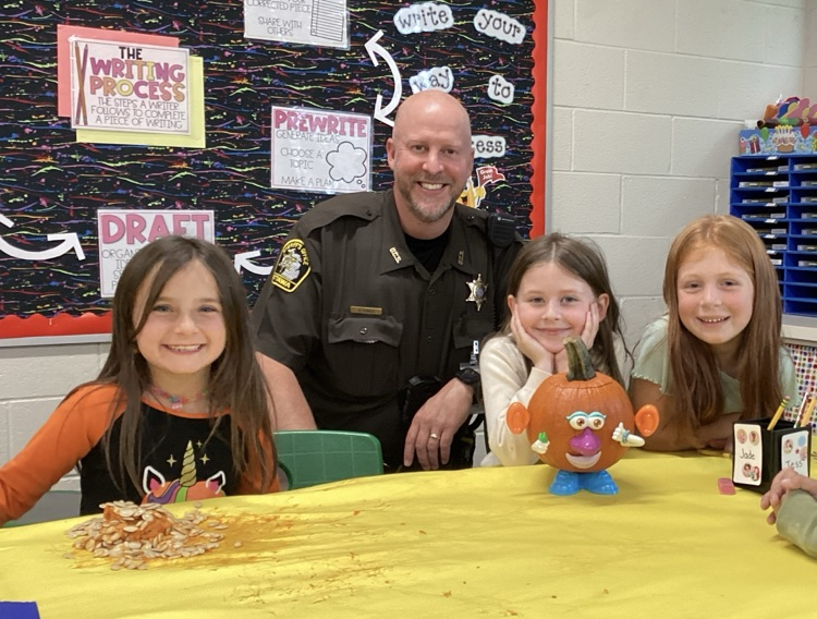 Students with SRO with decorated pumpkin