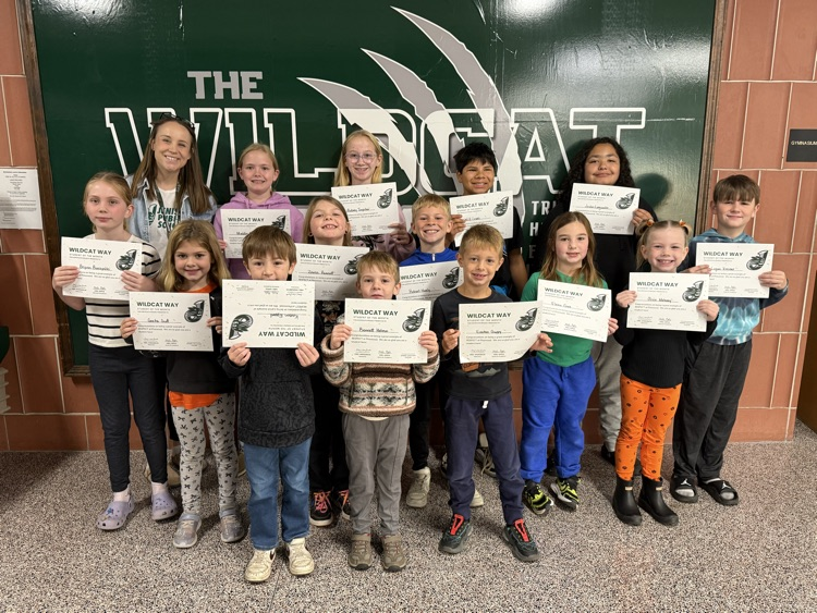 students holding certificates