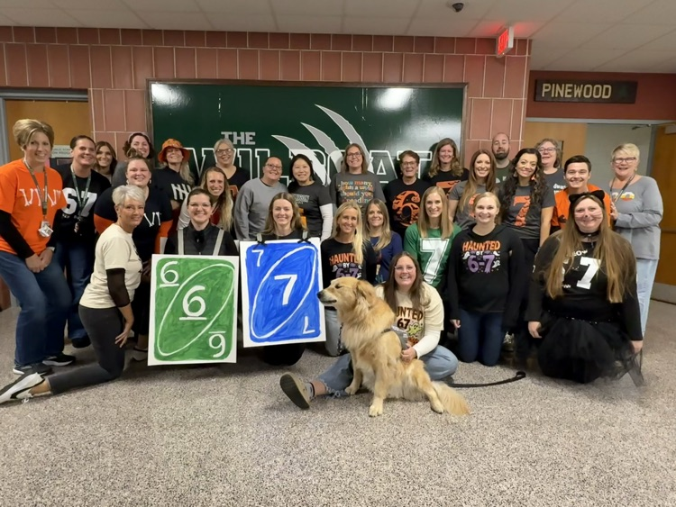 Staff dressed as 6/7 for Halloween