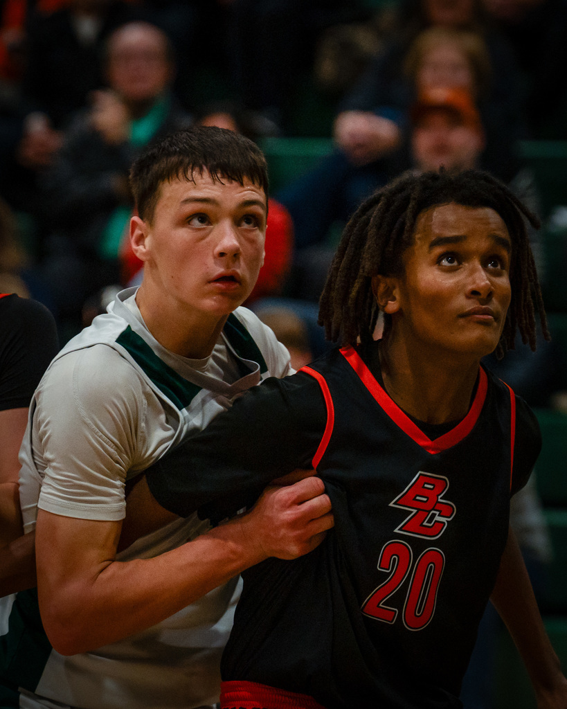Junior high basketball player rebounding