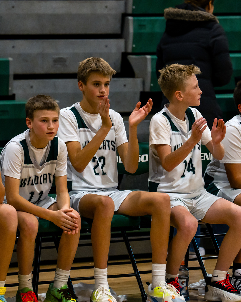 Junior high basketball players cheering