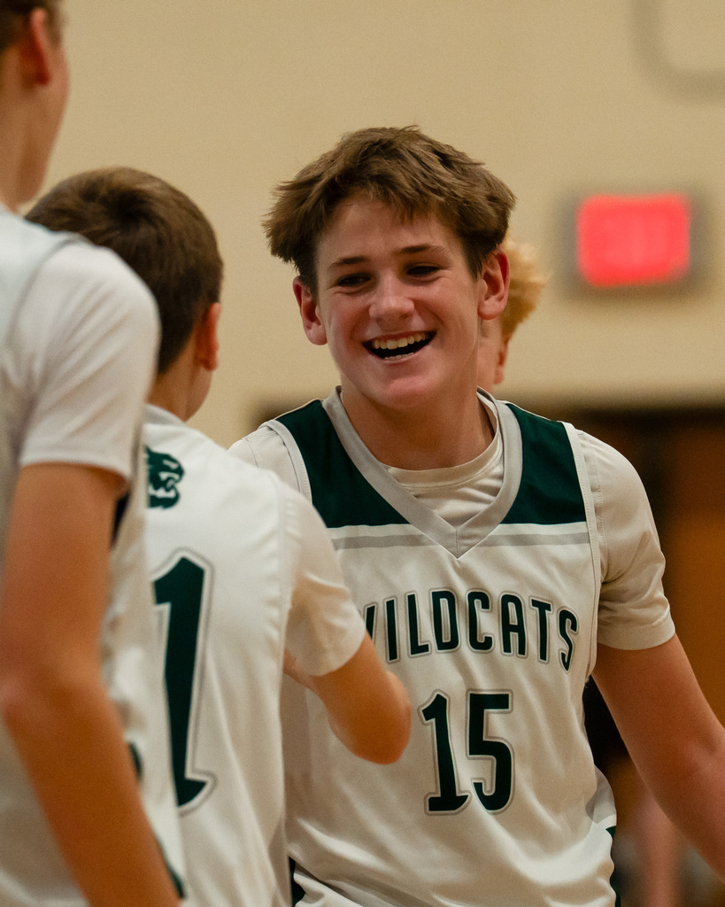 Junior high basketball players cheering
