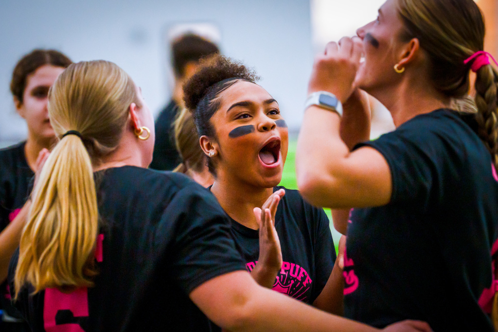 Powder puff players playing football