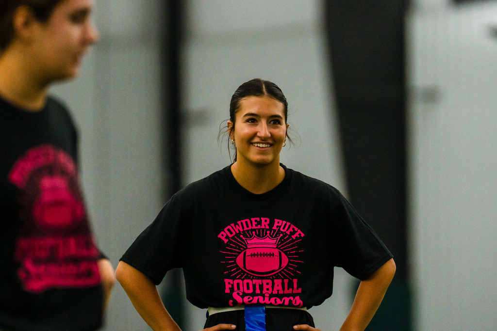 Powder puff players playing football