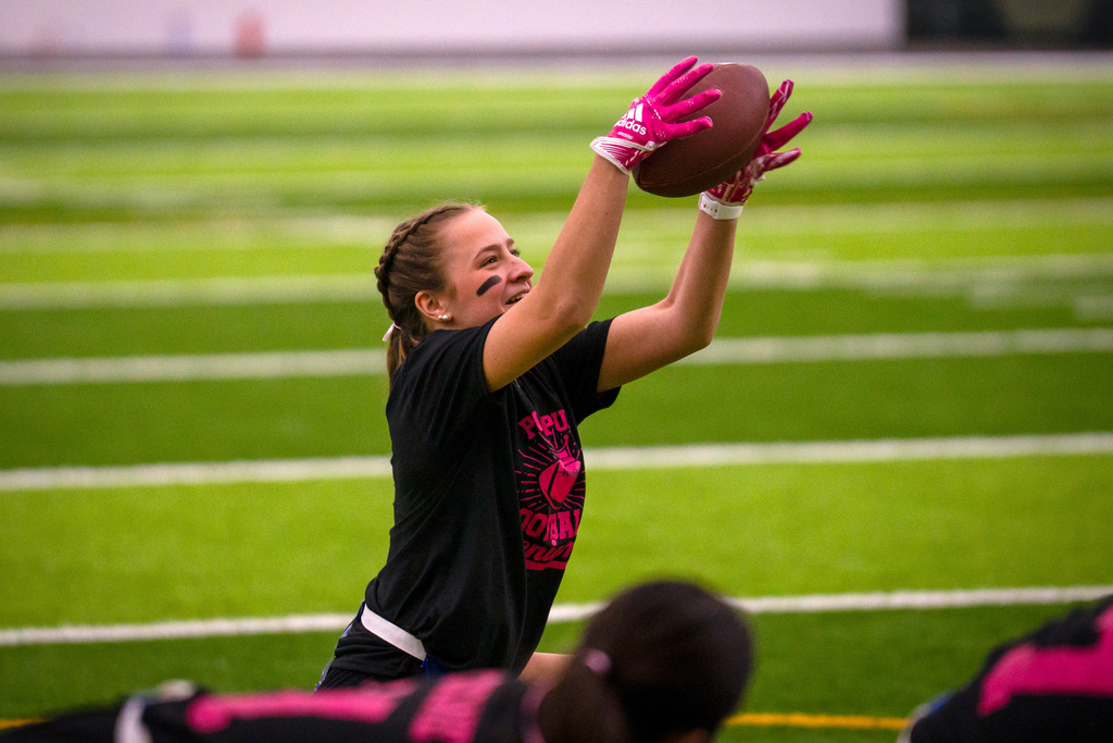 Powder puff players playing football