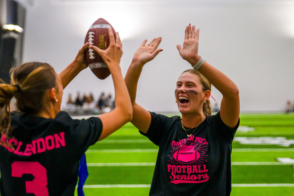 Powder puff players playing football