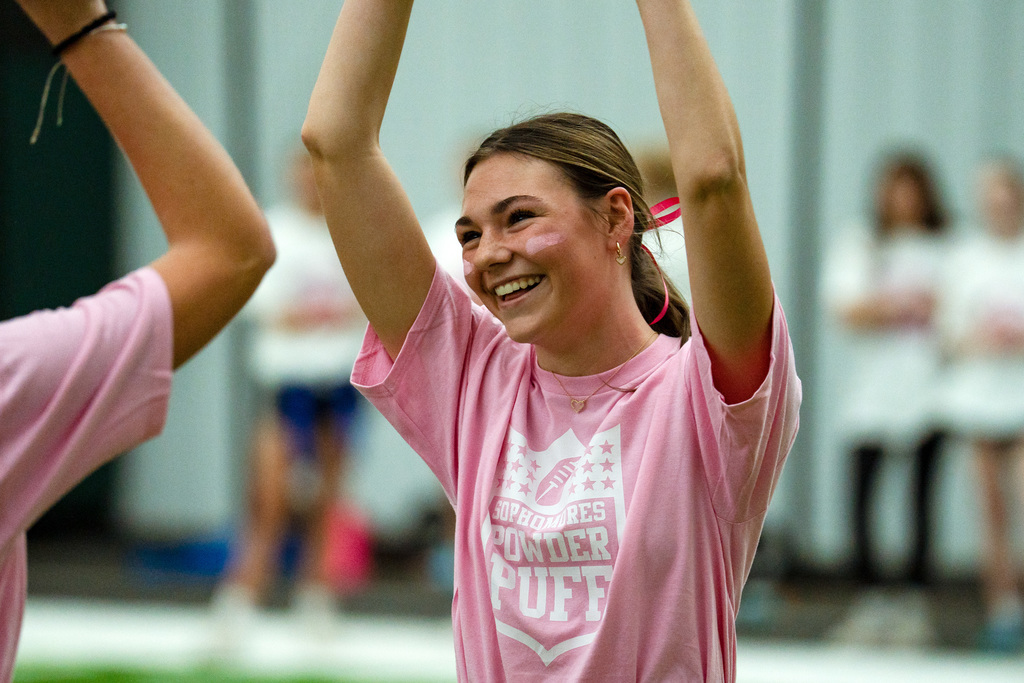 Powder puff players playing football