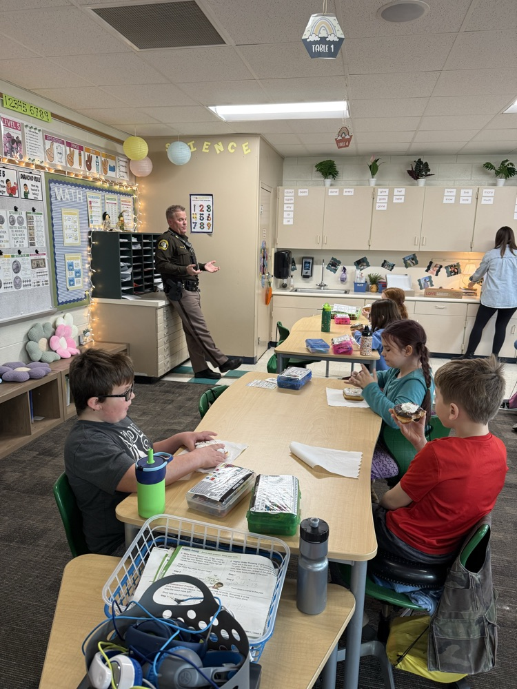 students talking to deputy 
