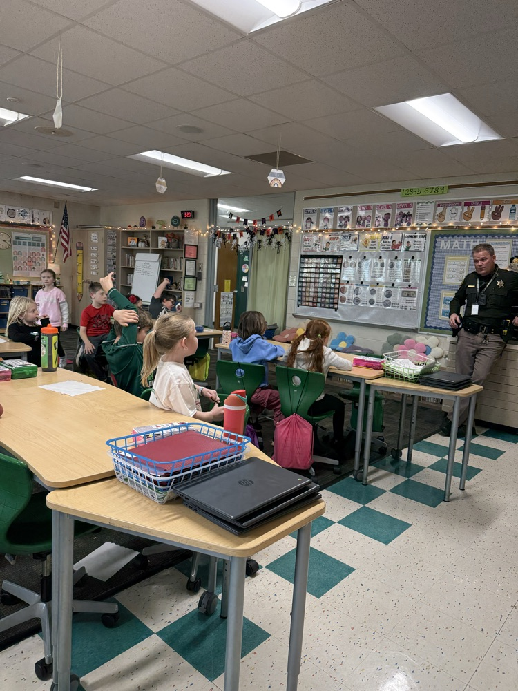 students talking to deputy 