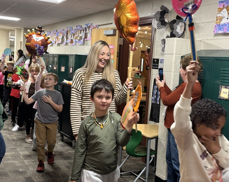 student with balloons