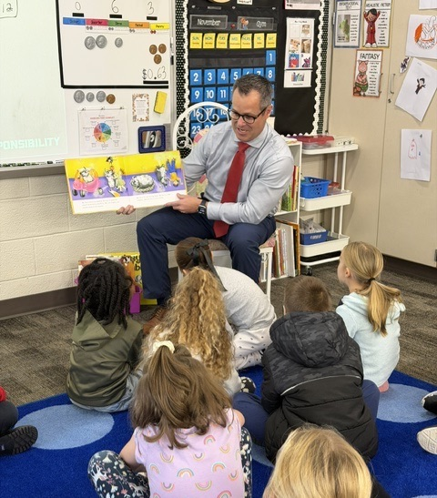 Dr Graham reading to class